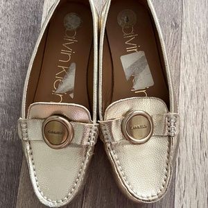 Gold Calvin Klein loafers